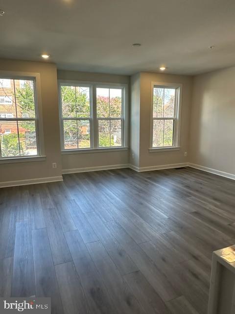 814 South Greenbrier Street Arlington, VA 22204 - Photo 11 of 27 an empty room with wooden floor and windows