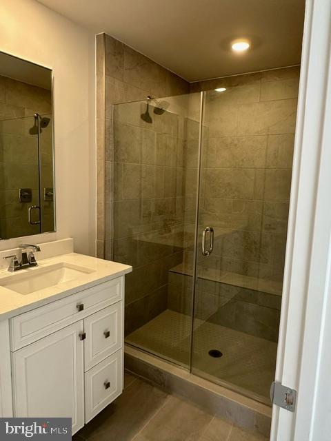 814 South Greenbrier Street Arlington, VA 22204 - Photo 14 of 27 a bathroom with a shower sink vanity and mirror