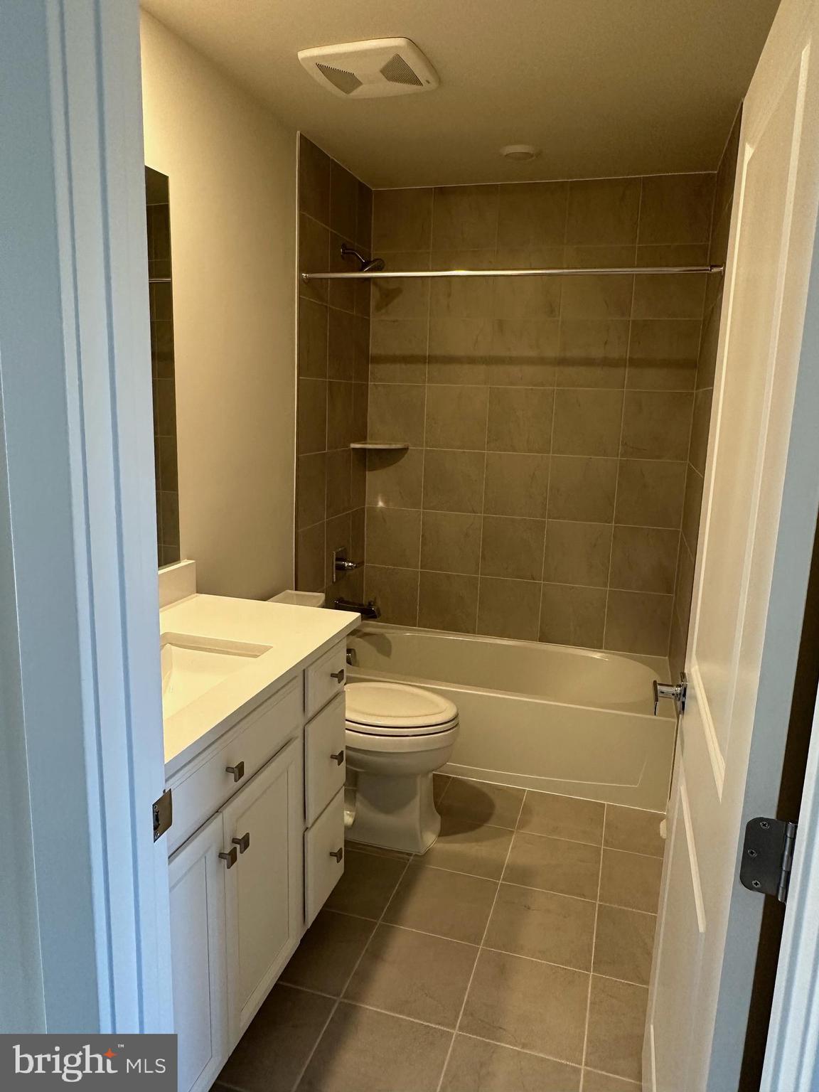 814 South Greenbrier Street Arlington, VA 22204 - Photo 19 of 27 a bathroom with a granite countertop sink a toilet and shower