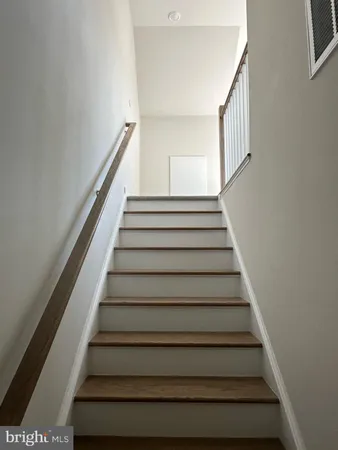 a kitchen with kitchen island a sink stainless steel appliances and cabinets