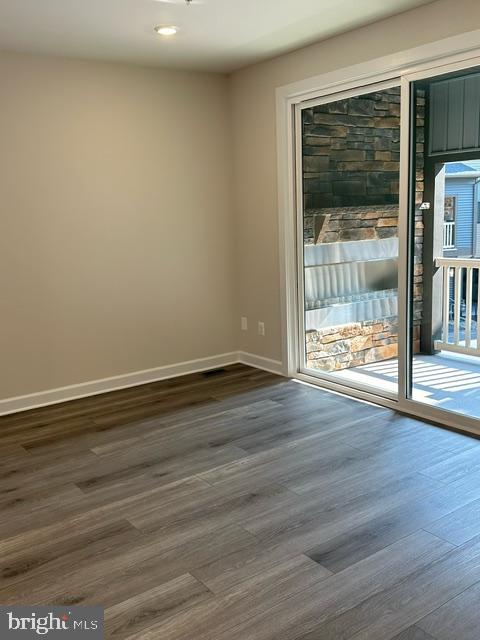 814 South Greenbrier Street Arlington, VA 22204 - Photo 9 of 27 a view of an empty room with wooden floor and a window