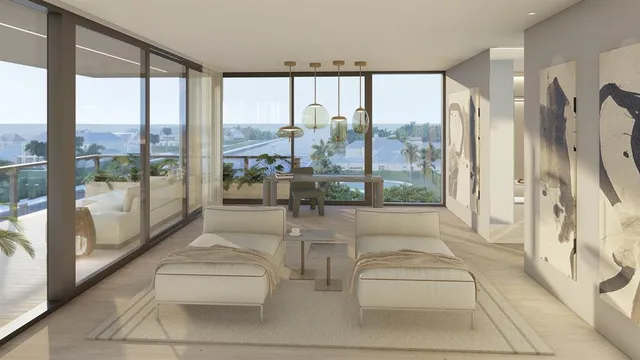 a room with large glass windows and furniture