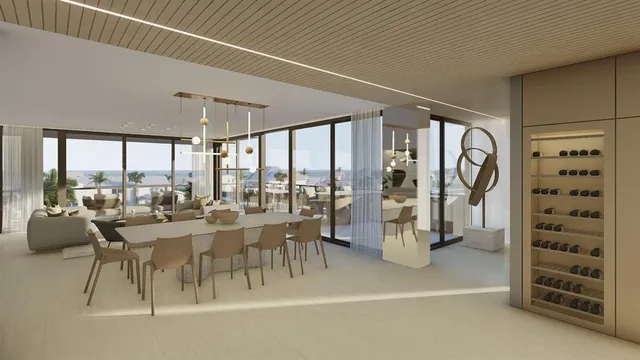 a very nice looking living room with a large window and chandelier