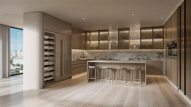 a kitchen with stainless steel appliances granite countertop a sink and refrigerator