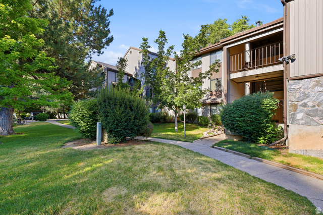 1175 Canyon Road, Unit 86 Ogden, UT 84404 - Photo 2 of 29 Landscaped grounds featuring mature trees and shrubbery