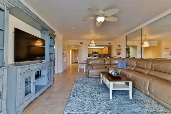 a kitchen with stainless steel appliances granite countertop a refrigerator a stove top oven a sink and dishwasher