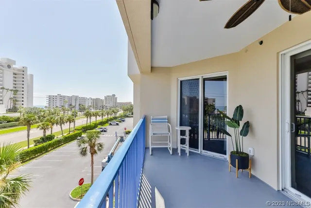 a en suite bathroom with a granite countertop sink and a mirror
