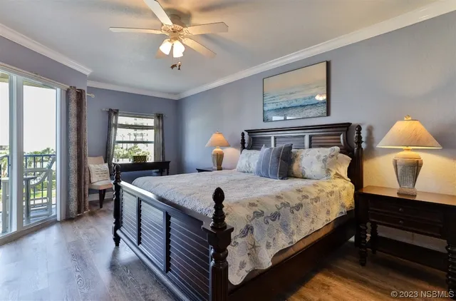 an aerial view of a house with swimming pool patio and balcony