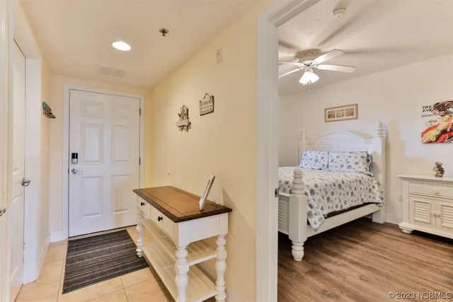 a living room with furniture a flat screen tv and a large window