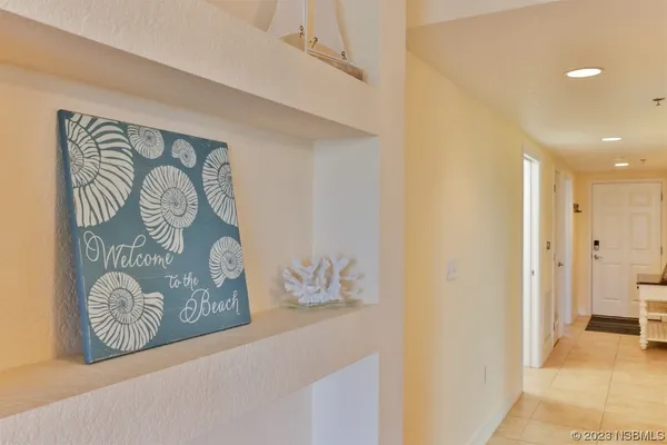 a living room with furniture a rug and a table