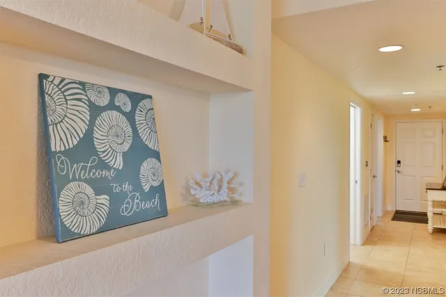 a living room with furniture a rug and a table