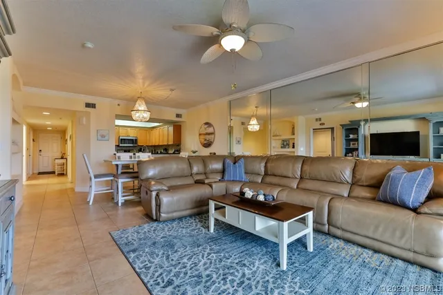 a view of a dining room with furniture and a large window