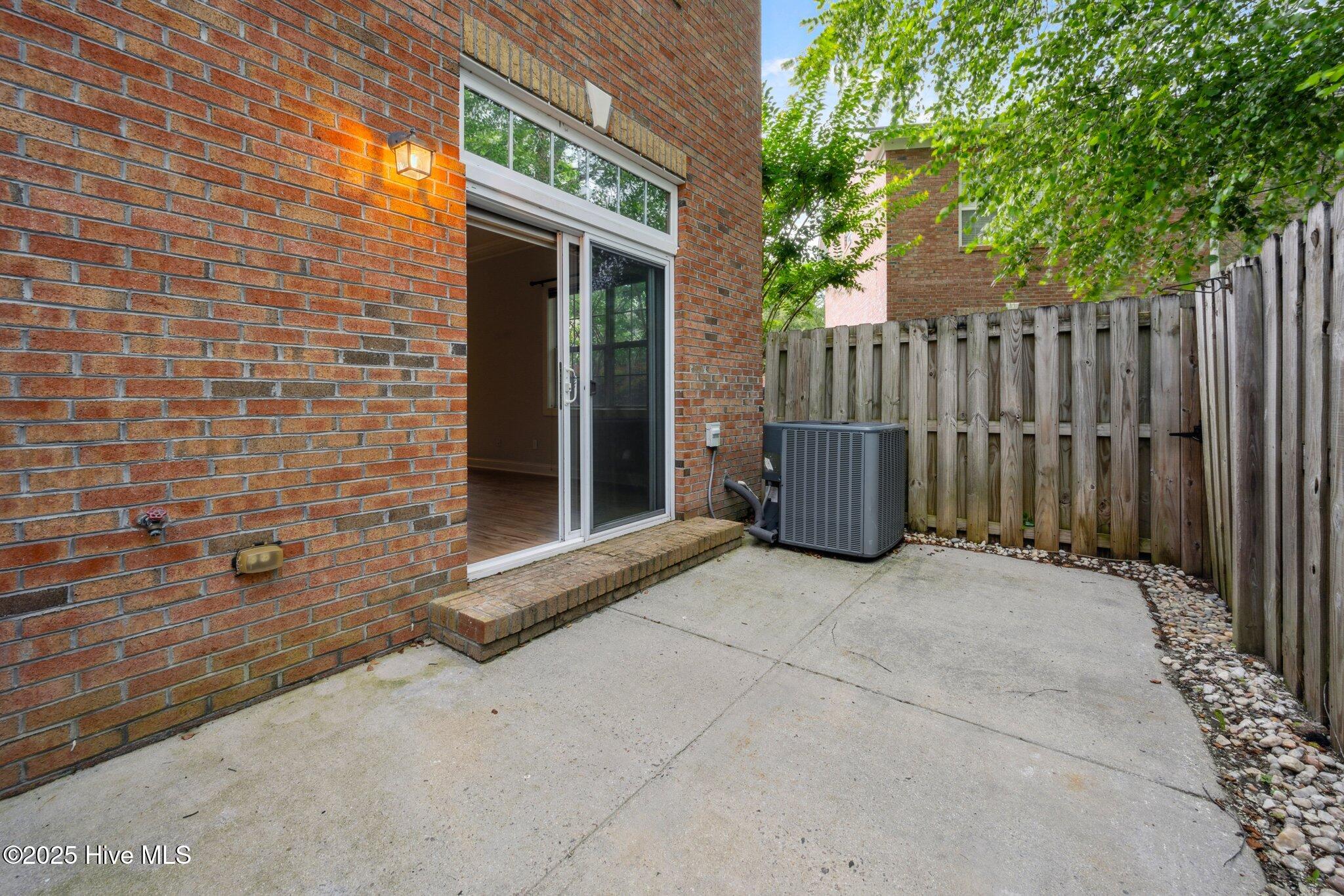 5147 Exton Park Loop Castle Hayne, NC 28429 - Photo 23 of 27 Fenced in Patio 1