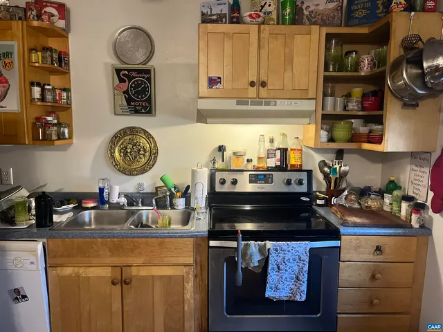 a kitchen with a cabinets and a stove