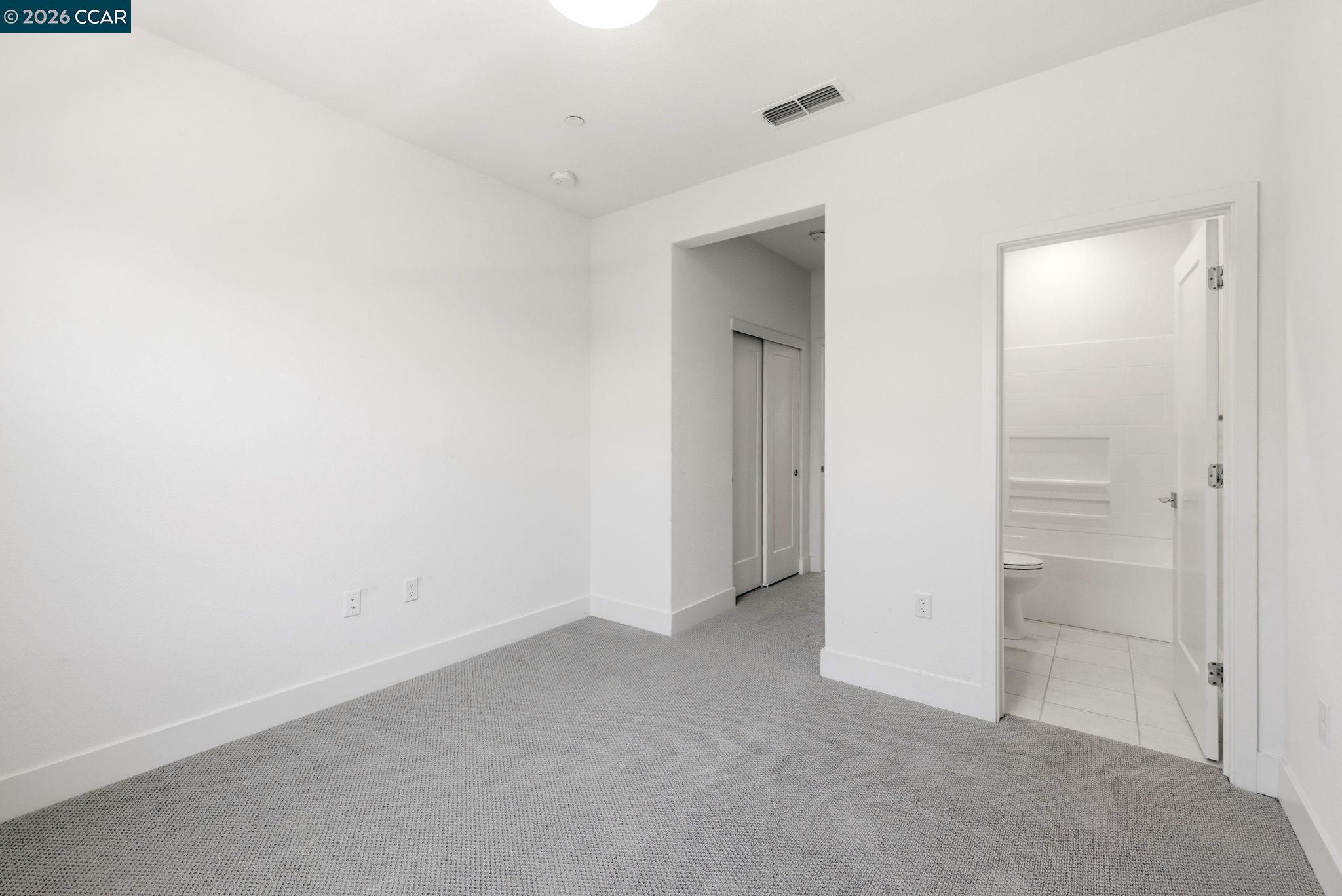 205 Plum Tree Street Livermore, CA 94551 - Photo 40 of 47 an empty room with closet and mirror
