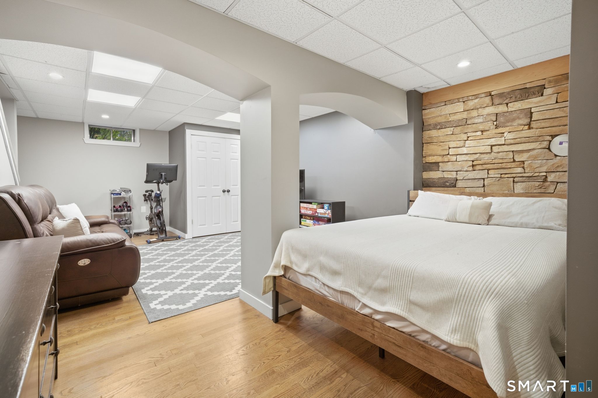 174 Walnut Hill Road Hartland, CT 06027 - Photo 30 of 36 a spacious bedroom with a bed and couch