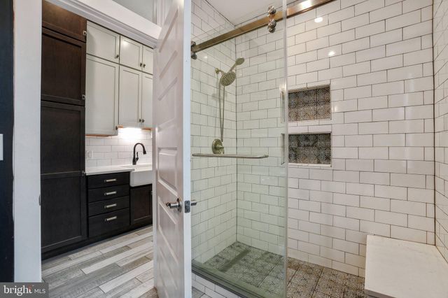 a bathroom with a sink and shower