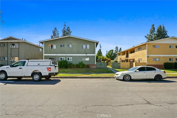 a view of car parked in front of a house