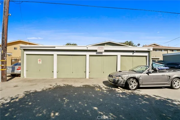 a front view of a house with parking space