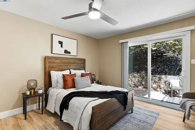 a bedroom with a large bed and a balcony