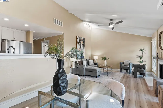 a living room with furniture a chandelier and a chandelier