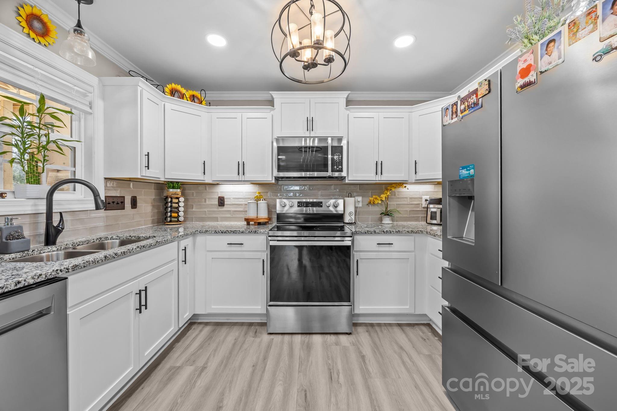 4255 Marshall Road Rock Hill, SC 29730 - Photo 11 of 43 a kitchen with a refrigerator and a stove top oven