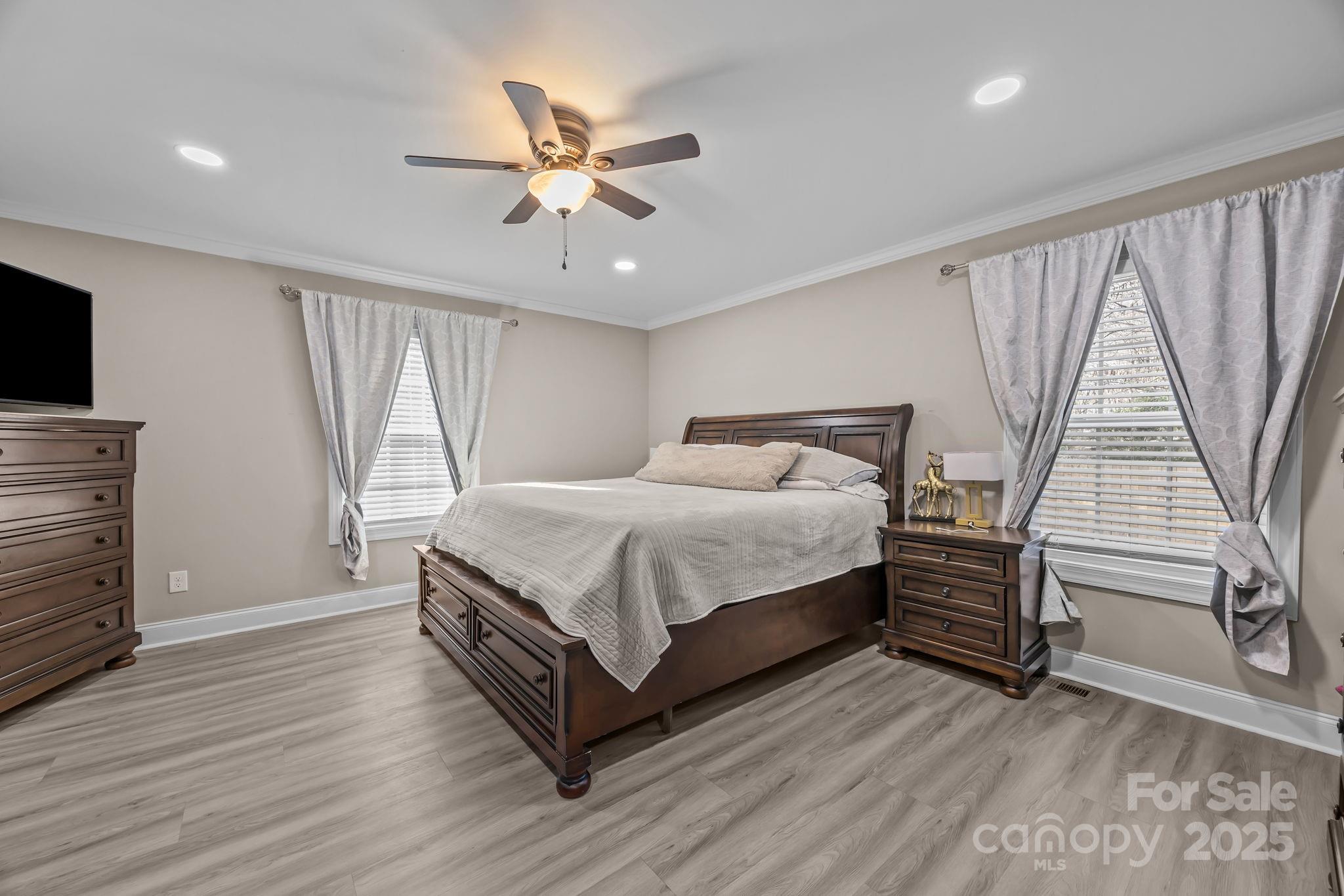 4255 Marshall Road Rock Hill, SC 29730 - Photo 14 of 43 a bedroom with a bed and a chandelier