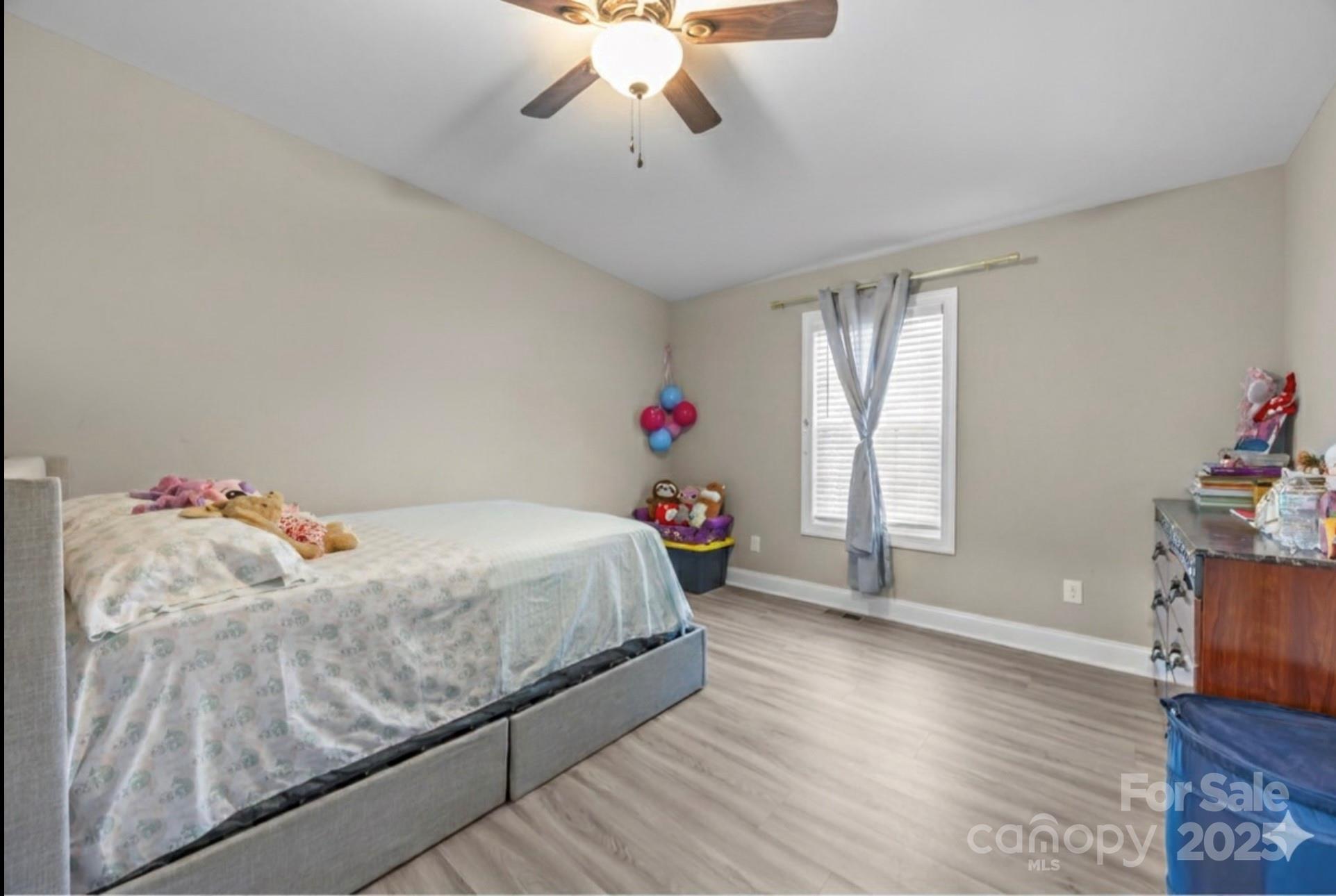 4255 Marshall Road Rock Hill, SC 29730 - Photo 19 of 43 a bedroom with a bed and wooden floor
