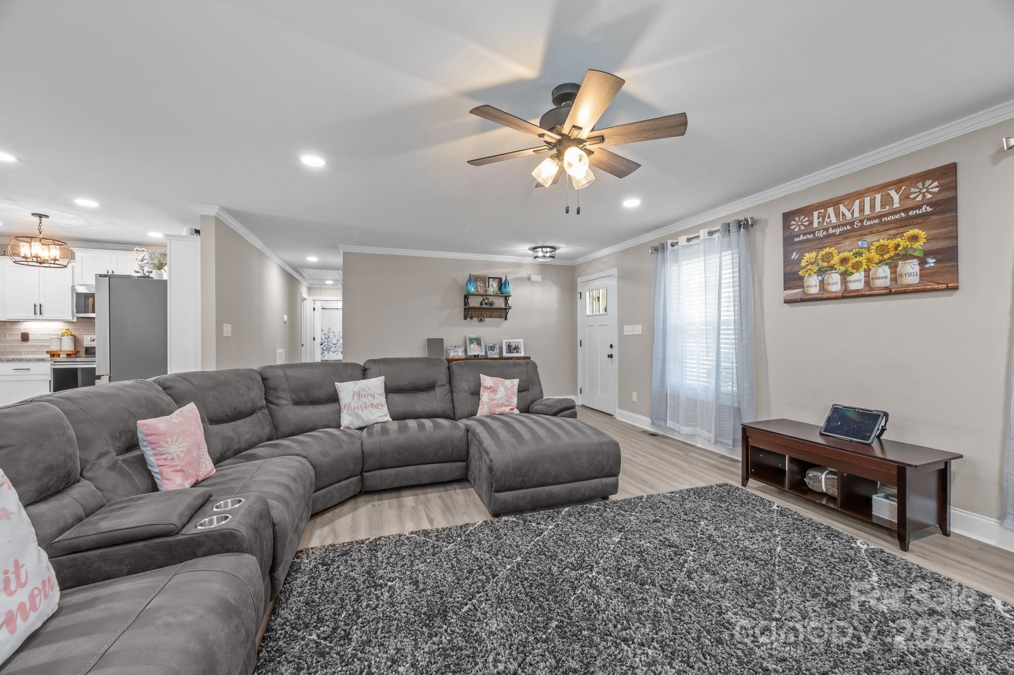 4255 Marshall Road Rock Hill, SC 29730 - Photo 4 of 43 a living room with furniture and a chandelier