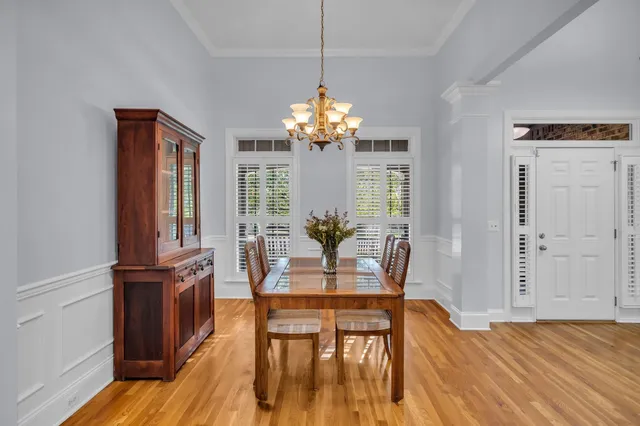 a view of a dining room with furniture window and wooden floor