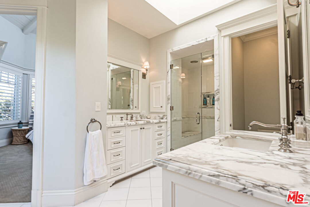 30760 Broad Beach Road Malibu, CA 90265 - Photo 15 of 41 a bathroom with a granite countertop sink mirror and