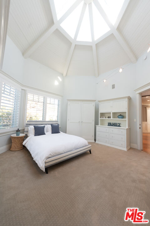 30760 Broad Beach Road Malibu, CA 90265 - Photo 16 of 41 a spacious bedroom with a bed and window