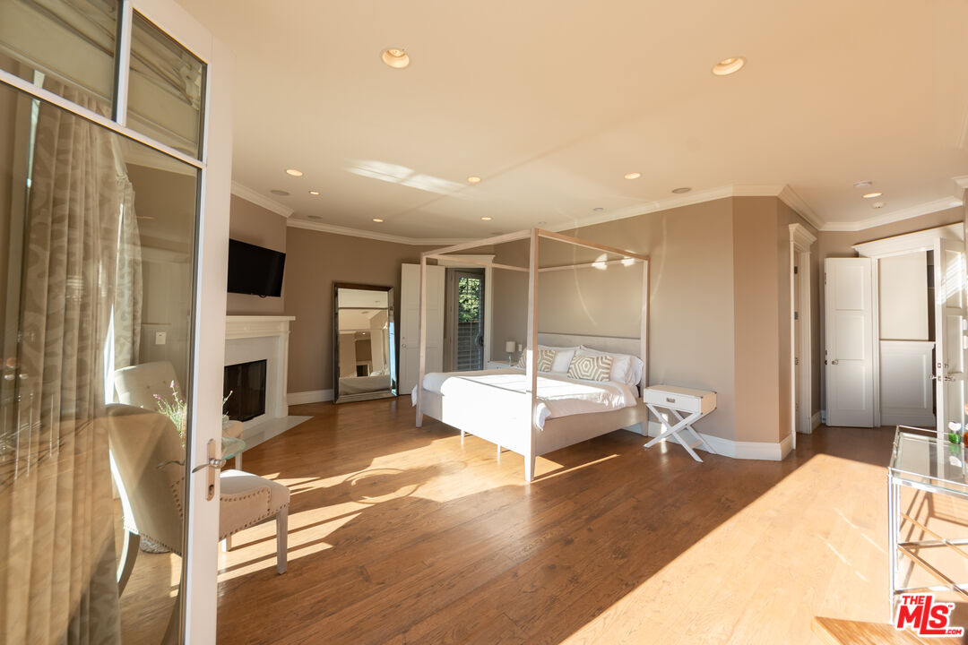 30760 Broad Beach Road Malibu, CA 90265 - Photo 20 of 41 a large bedroom with a bed and glass door