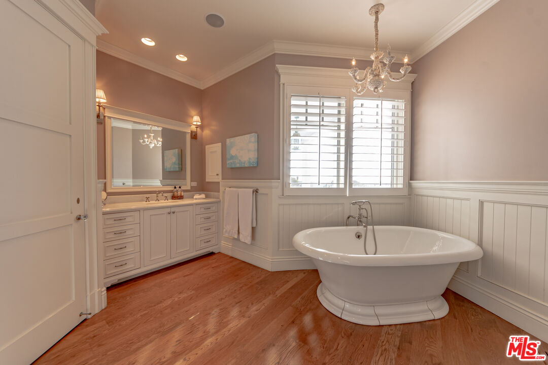 30760 Broad Beach Road Malibu, CA 90265 - Photo 21 of 41 a bathroom with a sink and a large mirror
