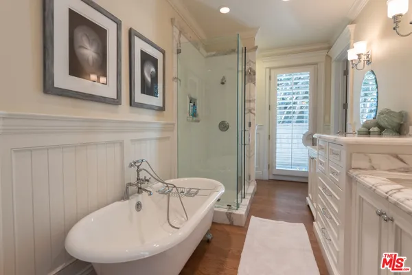 a bedroom with double bed and a large window