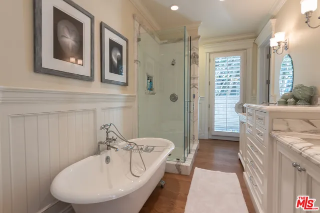 a bedroom with double bed and a large window