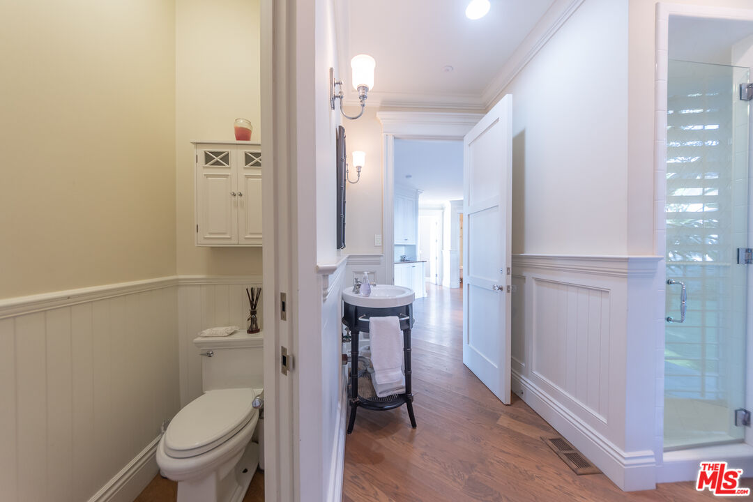 30760 Broad Beach Road Malibu, CA 90265 - Photo 29 of 41 a bathroom with a toilet a sink and mirror