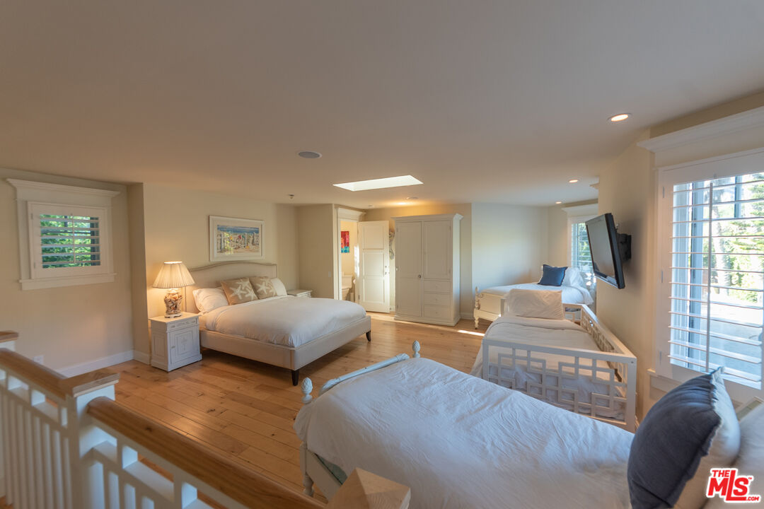 30760 Broad Beach Road Malibu, CA 90265 - Photo 39 of 41 a living room with furniture and a wooden floor
