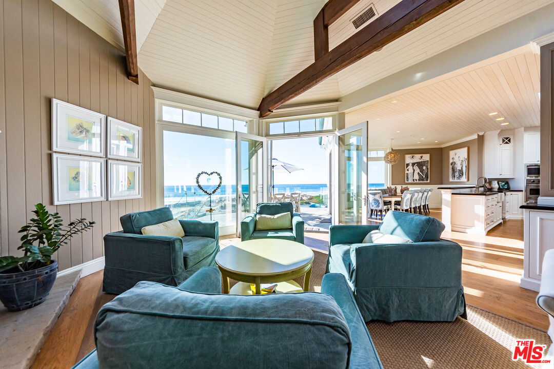 30760 Broad Beach Road Malibu, CA 90265 - Photo 4 of 41 a living room with fireplace furniture and a large window