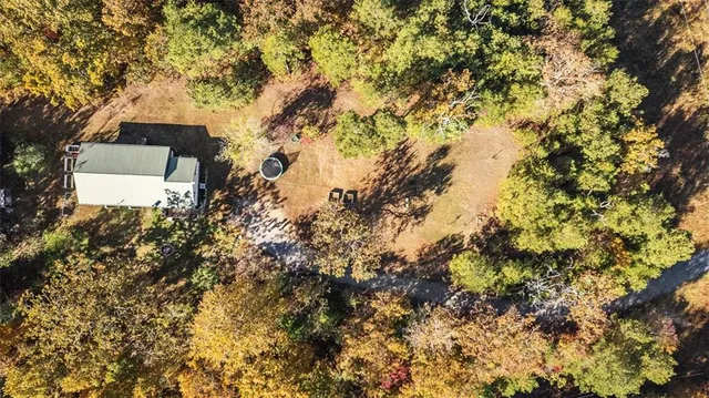 an aerial view of house with yard and mountain view