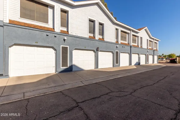 a front view of a house with a garage