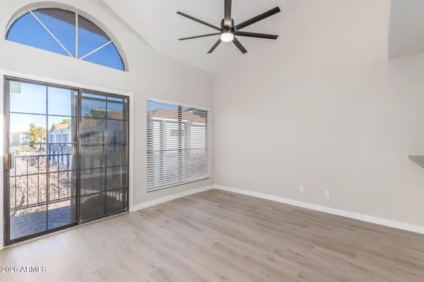 wooden floor in an empty room with a window