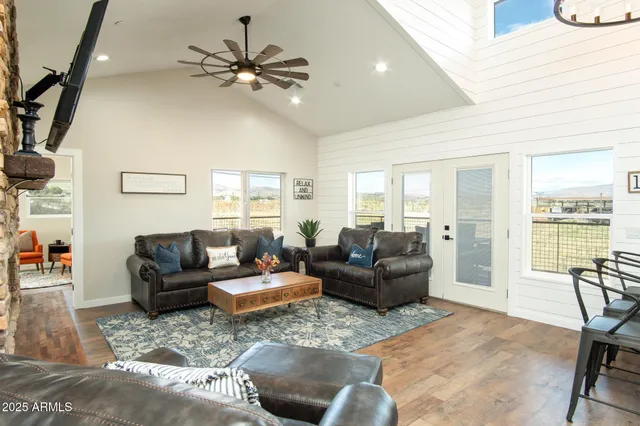 a kitchen with stainless steel appliances kitchen island granite countertop a refrigerator stove and sink