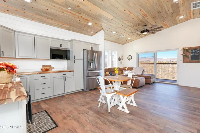 a bedroom with a bed a couch and a dresser