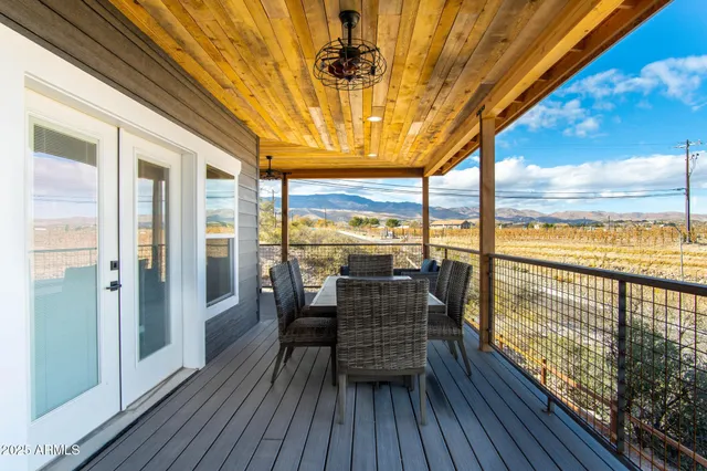 a balcony with chairs