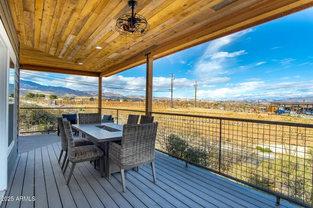 a view of a balcony with wooden floor