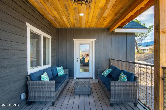 a view of balcony with wooden floor