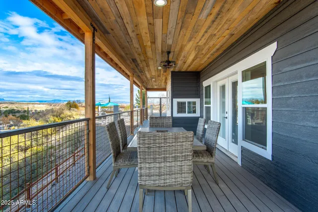 a living room with furniture and view of kitchen