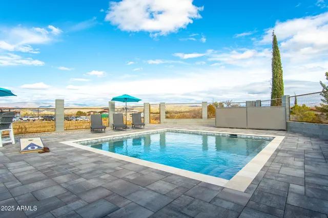 a view of a patio with swimming pool