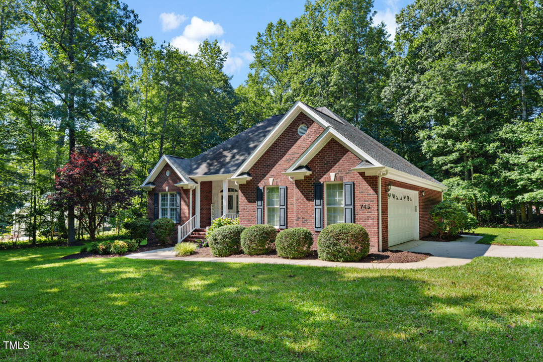 745 Oaks Lane Road Timberlake, NC 27583 - Photo 3 of 38 a front view of house with yard and green space